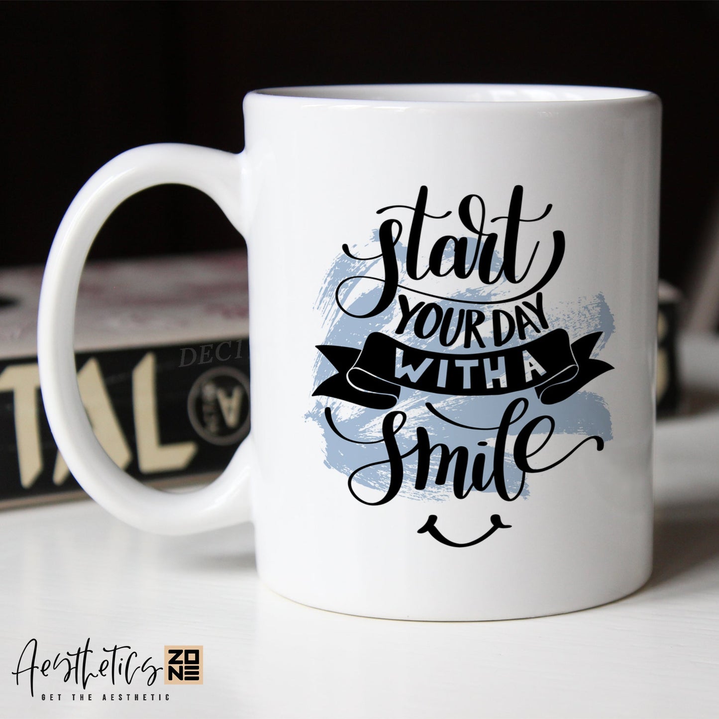 White coffee mug with motivational quote on a blurred background