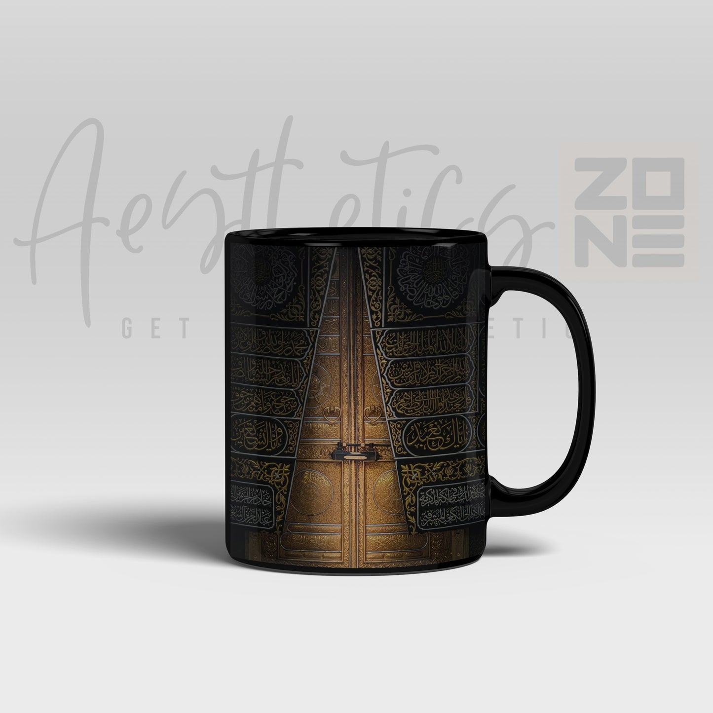 Black mug with a detailed design on a light gray background