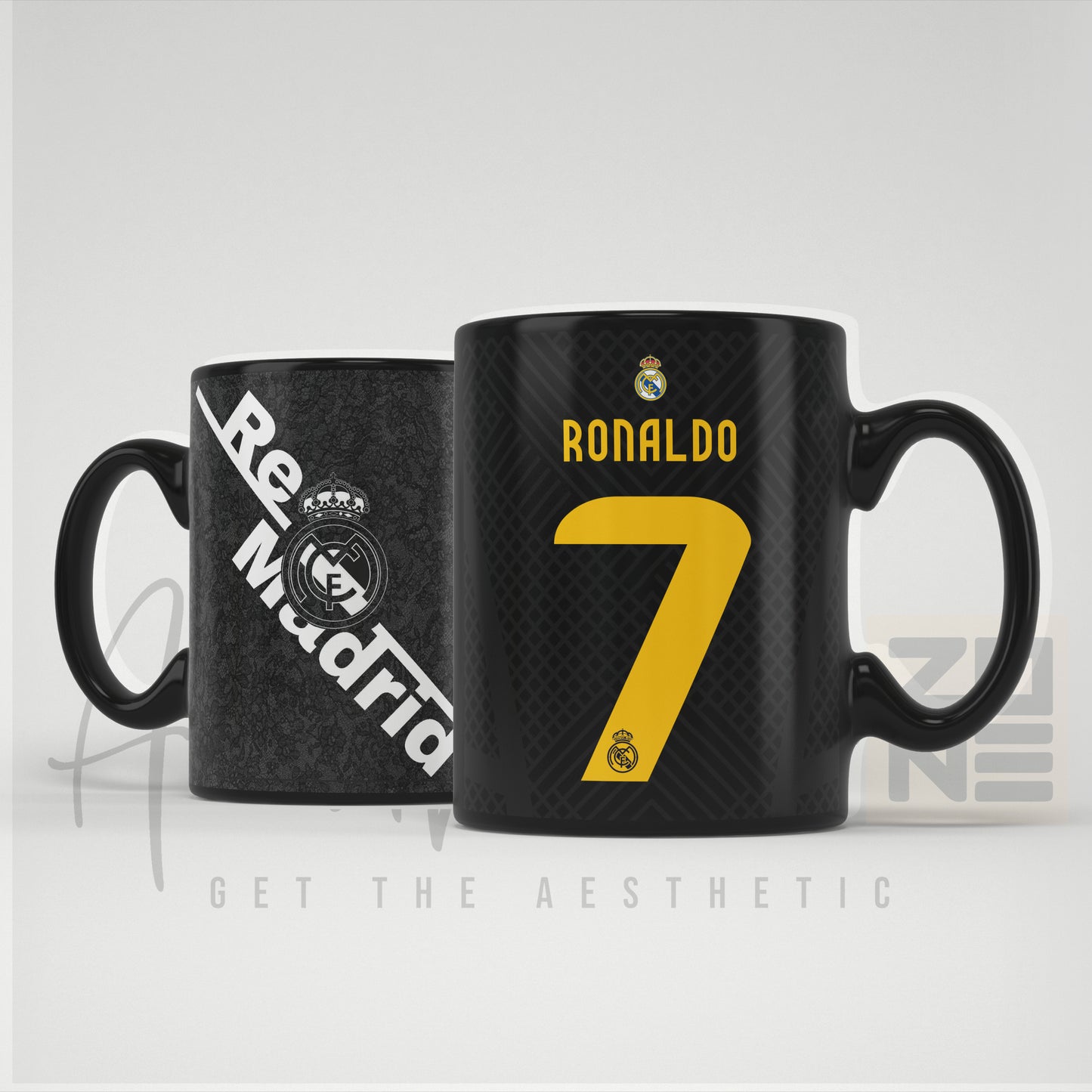 Two black mugs with 'Real Madrid' and 'Ronaldo 7' branding on a light gray background.