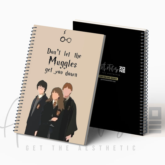 Notebook with Harry Potter design and text 'Don't let the Muggles get you down' on a white background.