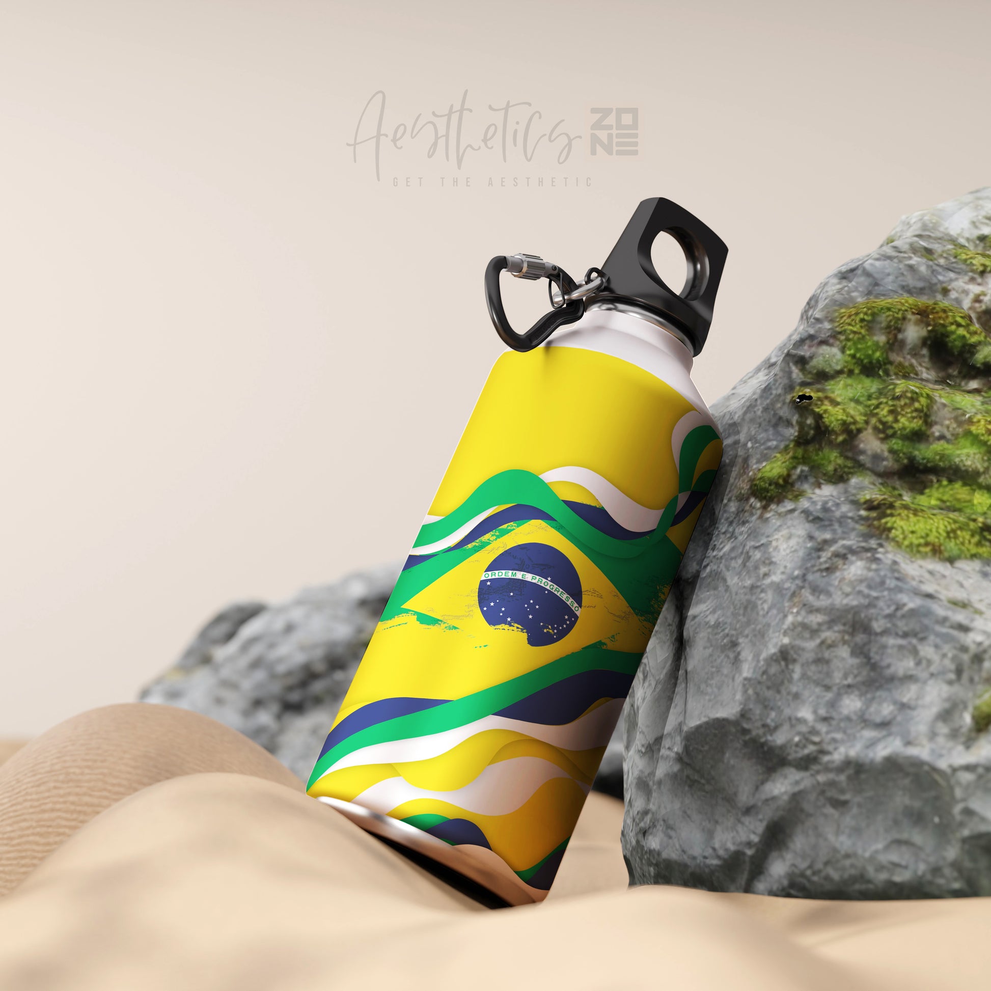 Colorful water bottle with Brazilian flag design on a rocky background