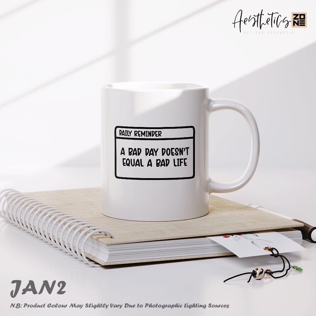 White mug with text on a notebook with a white background