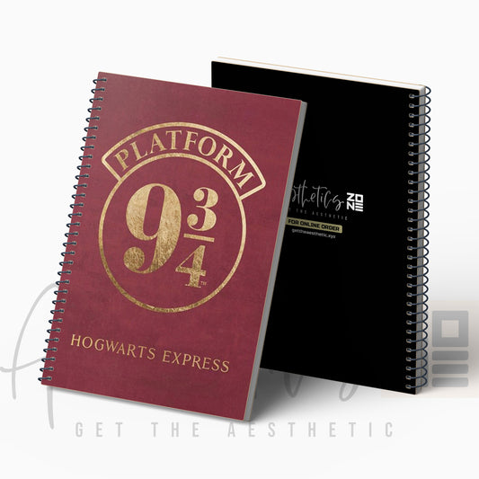 Maroon notebook with gold text 'Platform 9 3/4 Hogwarts Express' and a black notebook in the background.