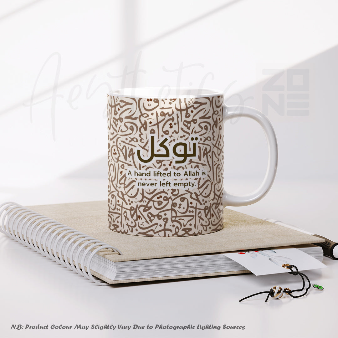 Mug with Arabic text and English translation on a notebook with a white background
