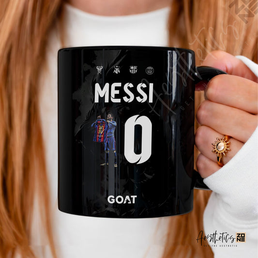 Black mug with 'Messi' and number '10' design, held by a person.