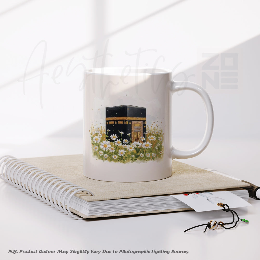 Mug with a design of the Kaaba and flowers on a notebook