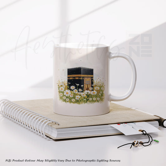 Mug with a design of the Kaaba and flowers on a notebook