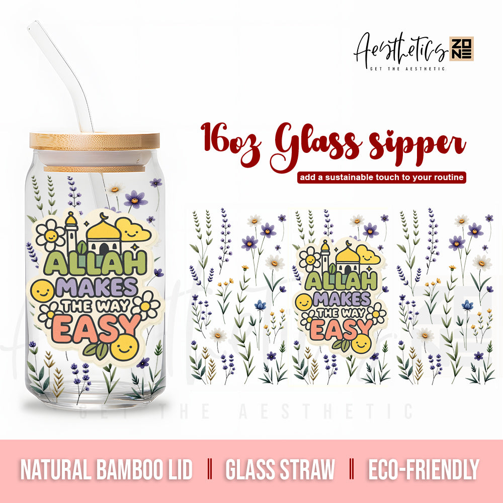 Glass sipper with floral design and text, featuring a natural bamboo lid and glass straw, on a white background.