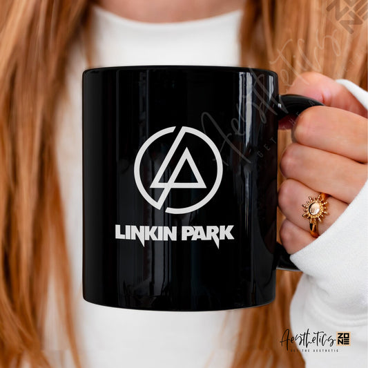 Black mug with Linkin Park logo held by a person