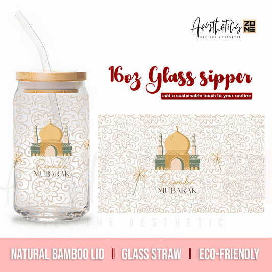 Glass sipper with bamboo lid and glass straw, featuring a design of a mosque and 'Mubarak' text on a white background.
