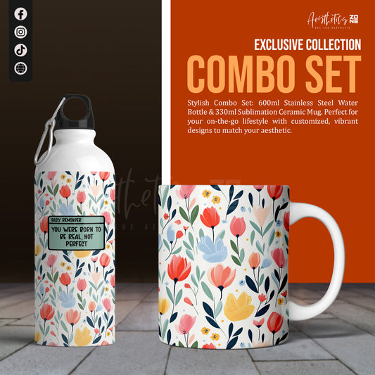 Stainless steel water bottle and ceramic mug with floral design on a dark surface