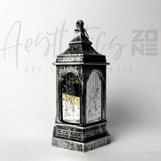Decorative lantern with intricate designs on a white background, featuring the brand 'Aesthetic Zone'.