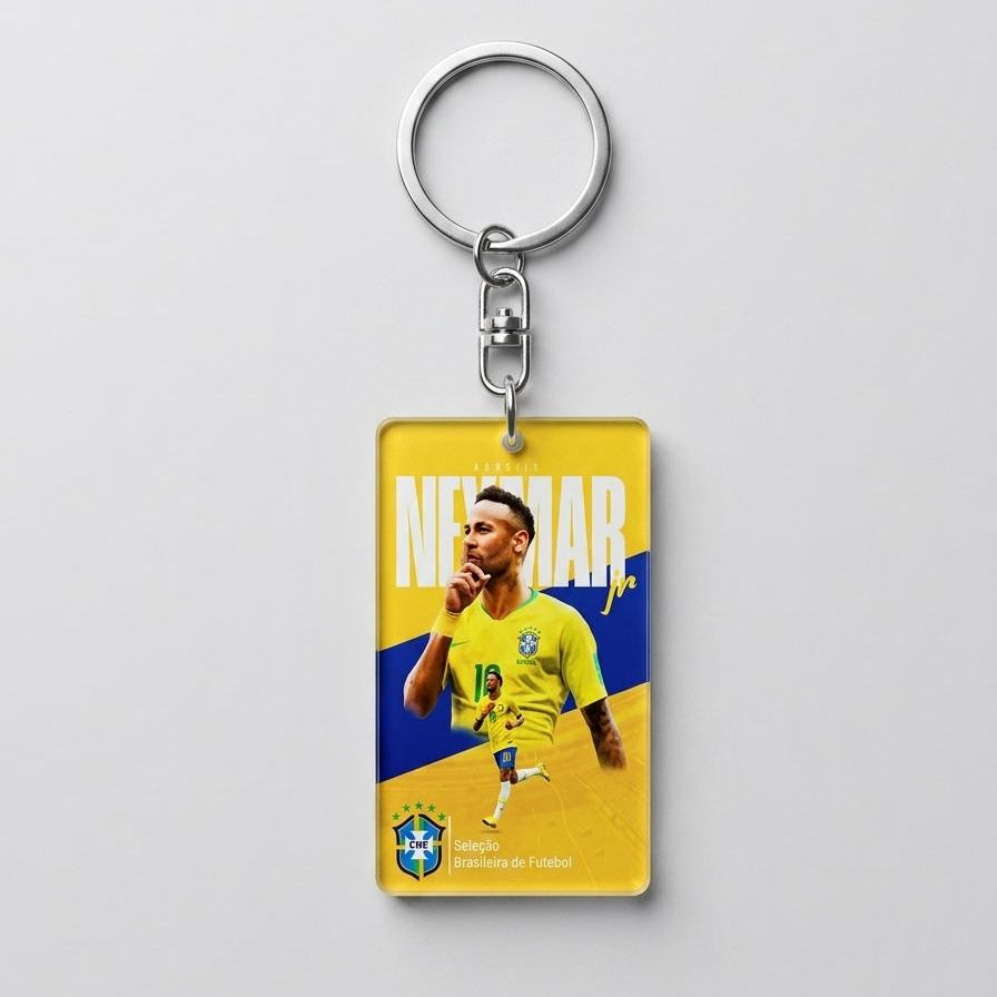 Keychain with a soccer player in a yellow and blue jersey on a gray background